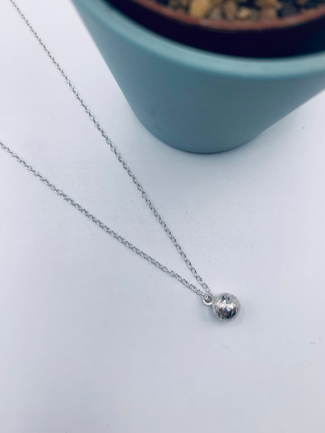 Sterling silver hollow textured ball necklace